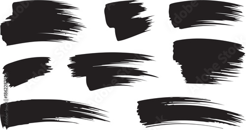A collection of black paint brush strokes with varied rough edges displayed on a bright white background
