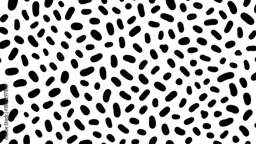 Abstract pattern of black oval shapes scattered across a white background.