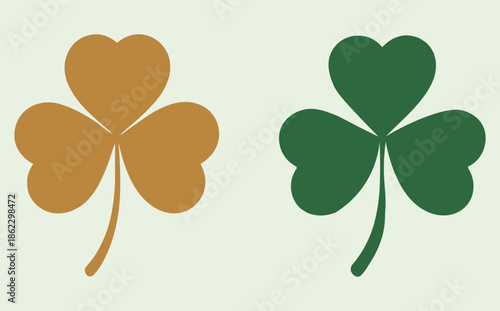 Two stylized shamrocks, one golden-brown and one green, symbolizing Irish culture and good luck.