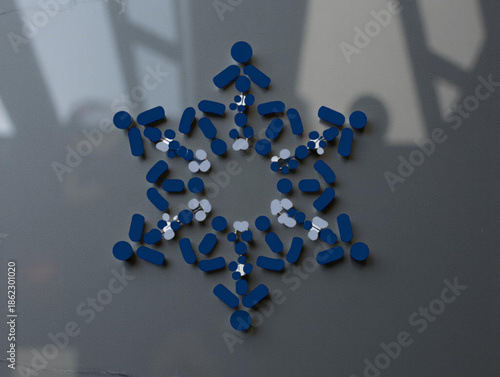 Blue and silver pills in circle.