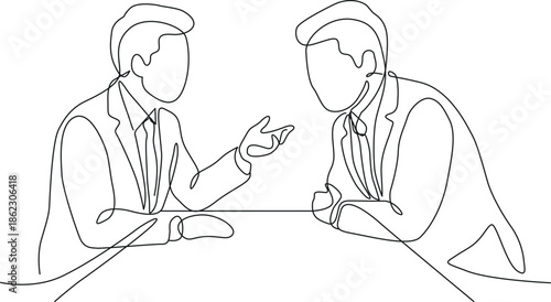 Two men discussing business at a table