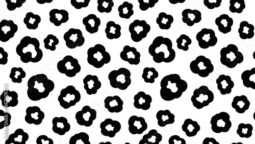 Black and white seamless pattern featuring abstract floral or animal print design scattered across the surface.