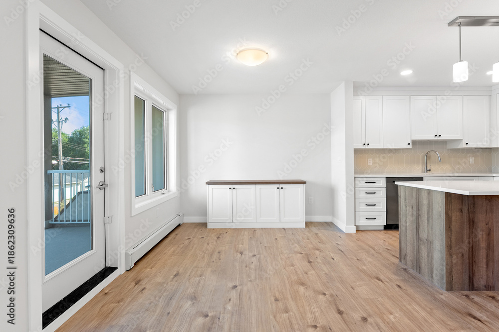 Fototapeta premium Large open kitchen with a wooden island and a sink