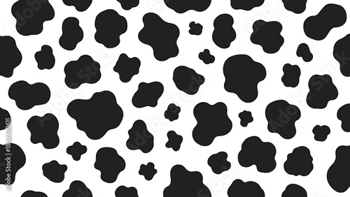 Black and white cow pattern with irregular spots scattered across the surface.