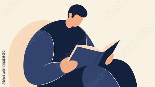 Man engrossed in reading a book while relaxing in a chair.