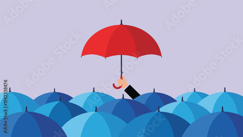 Red umbrella held by a hand standing out from a crowd of blue umbrellas