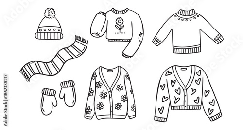 Cozy autumn doodle set of autumn clothing hat mittens scarf cardigans sweaters, line art monochrome hand drawn outline