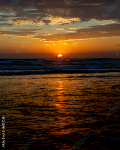 Sun setting over the Pacific Ocean from Mission Beach in San Diego, California, USA taken on June 1, 2025