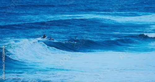 Wallpaper Mural Dynamic Big Wave Surfing in a Vast Blue Ocean with Jet Ski Assistance Torontodigital.ca