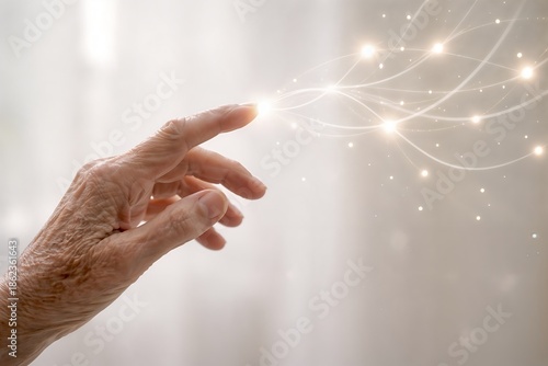 Elderly human hand touching soft digital light, symbol of artificial intelligence support, care and connection between people and technology, future healthcare and human centered innovation.