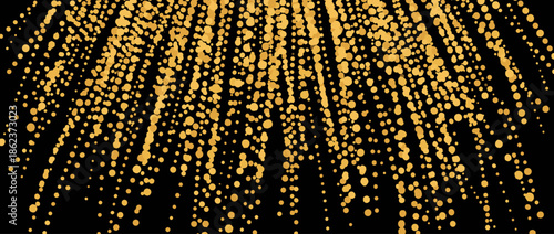 Golden falling confetti dots create a festive rain pattern for a luxury celebration or holiday event banner, isolated on a solid black background for copy space