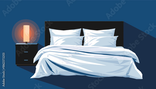 Large unmade bed with fresh white linens and pillows sits next to a glowing bedside lamp in a dark, quiet bedroom at night, creating a cozy and peaceful atmosphere