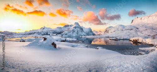 Wallpaper Mural Amazing Flakstadpollen and Boosen fjords with cracks on ice during sunrise with Hustinden mountain on background. Torontodigital.ca