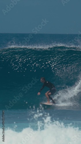 Surfer Powering Through Steep Barreling Wave, Explosive Top Turn And Heavy Spray, Performance Stance On Board,vertical video