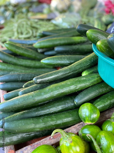 Japanese cucumbers at the farmers' market. Greens at the market.