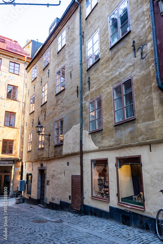 A street lined with colorful houses in Stockholm's historic Gamla Stan district.. Sweden, Stockholm\