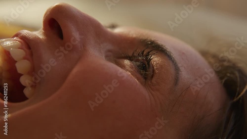 Retro Dreamcore woman Listening to music laying down and signing out loud to herself - close up on mouth and eyes