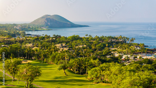 Photos Panoramic aerial view of Maui, Hawaii golf course resort surrounded by lush palm