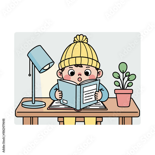 Cute child reading book at desk with lamp and plant nearby