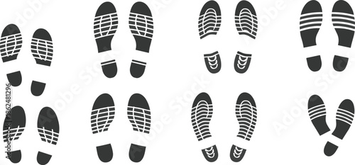 Set of black shoe footprint vector icons showing walking steps, footwear soles, shoeprints pattern, and trail marks for design and signage.