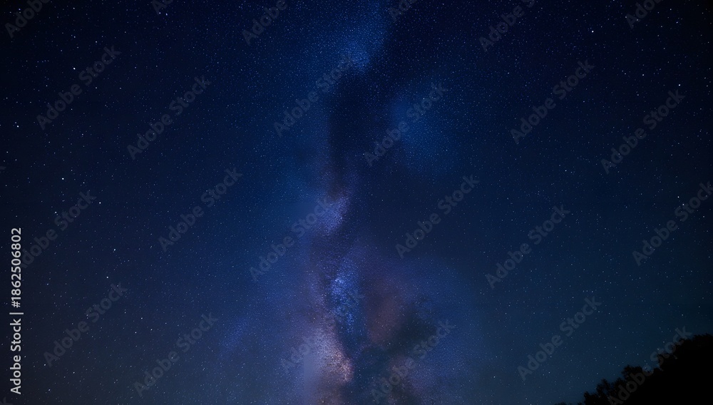 Fototapeta premium Majestic milky way stretching across the dark blue night sky