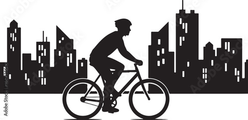 A silhouette of a man riding a bicycle through a city