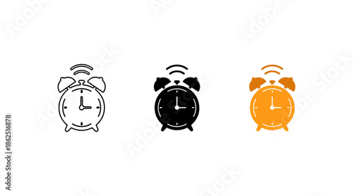 Three colored alarm clocks