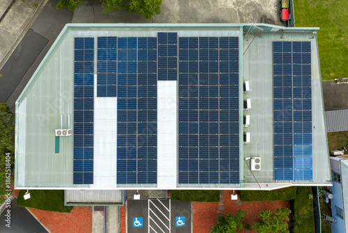Drone aerial photograph of a large array of Solar Panels on the roof of a commercial building in the Blue Mountains in New South Wales, Australia.