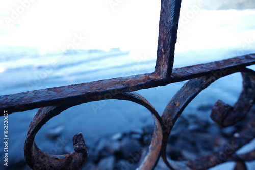 rusty metal, against the blue sea