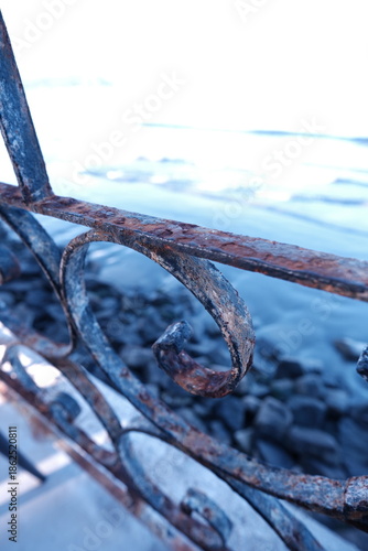 rusty metal, against the blue sea