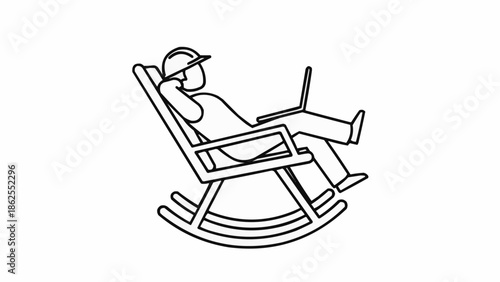 Man in rocking chair with laptop wearing hard hat.
