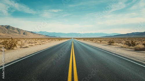 An empty, straight road stretching to a vanishing point in the desert horizon, under a vast, open sky, symbolizing a journey, minimalist and powerful.