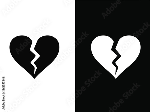 A broken heart symbol in black and white, split into two contrasting halves, against a divided white and black background, conveying a sense of love and heartbreak.