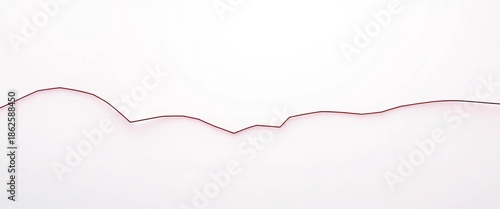 A continuous, broken, wavy line drawn with dashes,  separator,   border