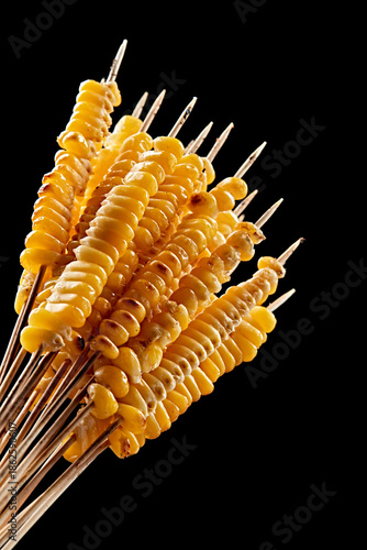 Charcoal-grilled corn kernel skewers