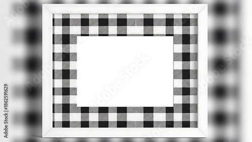 A white rectangular frame with a black and white checkered border is centered on a blurred background