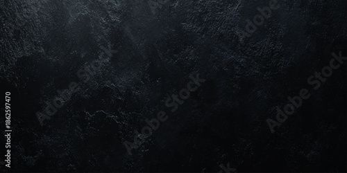 A dark textured background with subtle gradients and shadowy formations creating an atmospheric and mysterious visual experience