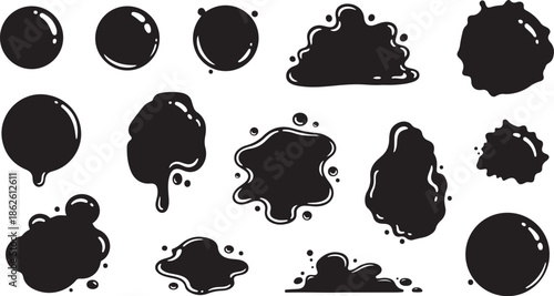 A collection of black ink splatters on a white background