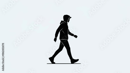Silhouette of a person walking with a hood up.