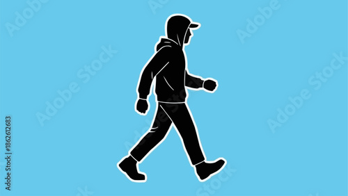 Silhouette of a person walking wearing a hooded jacket and cap.