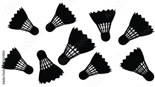 A collection of badminton shuttlecocks displayed in a striking black silhouette
