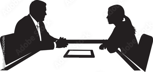 A man and woman in business attire shaking hands across a table