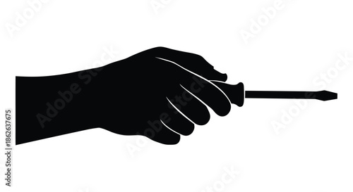 A hand firmly gripping and pointing with a screwdriver a striking silhouette
