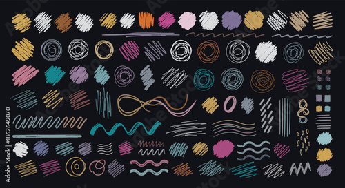 Array of colorful abstract marks, scribbles, circles, and wavy lines resembling crayon, chalk, or pencil on a dark background.