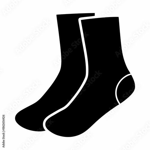 A pair of solid black socks isolated on a white background