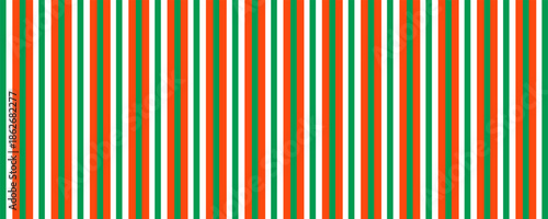 Christmas seamless pattern. Red and green diagonal stripes background. Candy cane repeating decoration wallpaper. Winter holiday lines backdrop. Xmas peppermint package wrapping print design. Vector