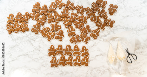 Decorating Gingerbread Man Cookies with Royal Icing for Festive Occasions