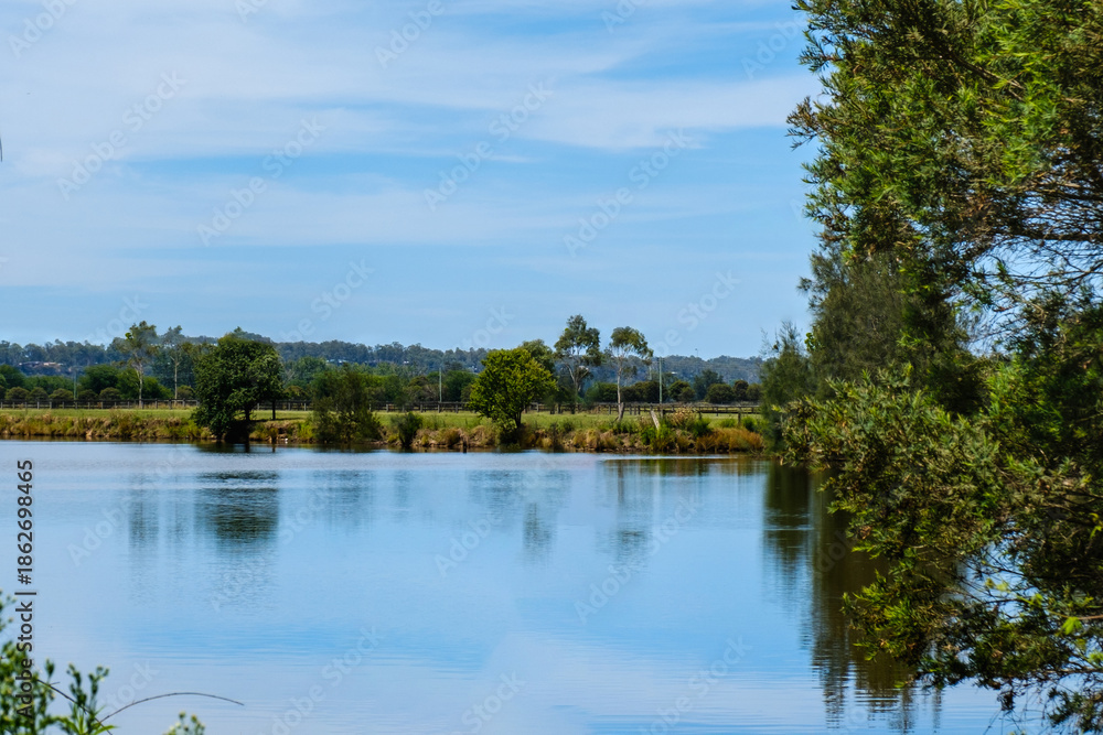 Obraz premium Photo taken in December 2025 in Richmond, NSW, The image captures the character of this historic town, with nearby river and park landscapes, showing people enjoying everyday life within a natural set