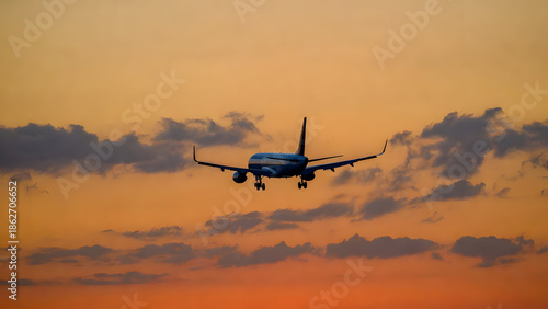 Wallpaper Mural Dramatic View of a Jet Aircraft Landing Against an Orange Twilight Sunset Sky Torontodigital.ca
