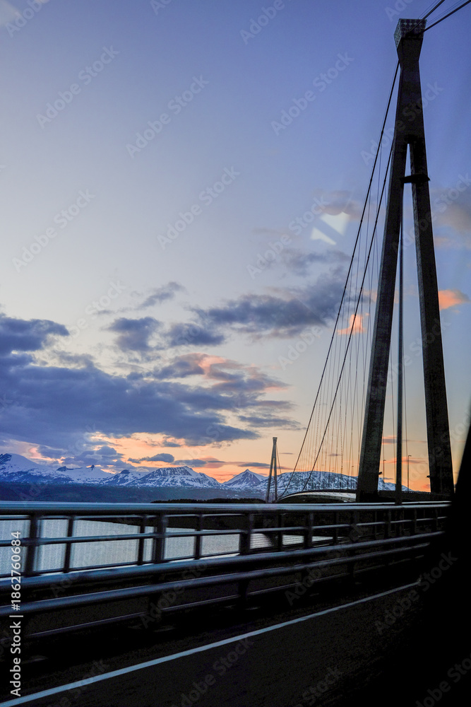 Fototapeta premium bridge over the sea with mountain landscape 